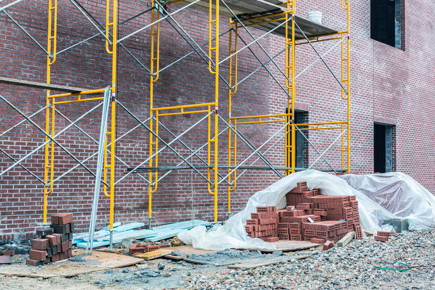 Plastic Sheeting covering bricks on construction site